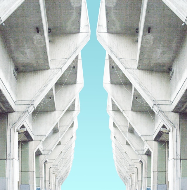 Parallel imports, mirror image of grey blocks, blue sky